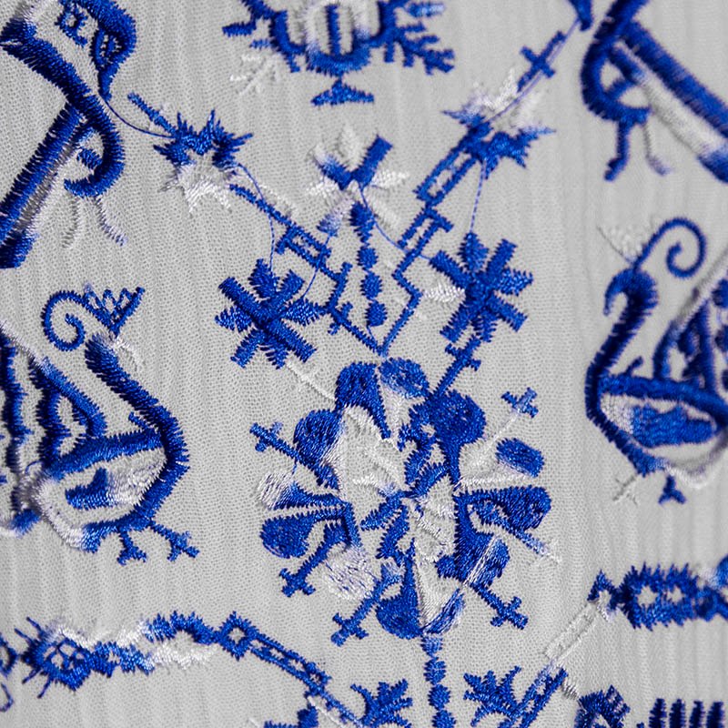 Jenny - White blouse with blue embroidery